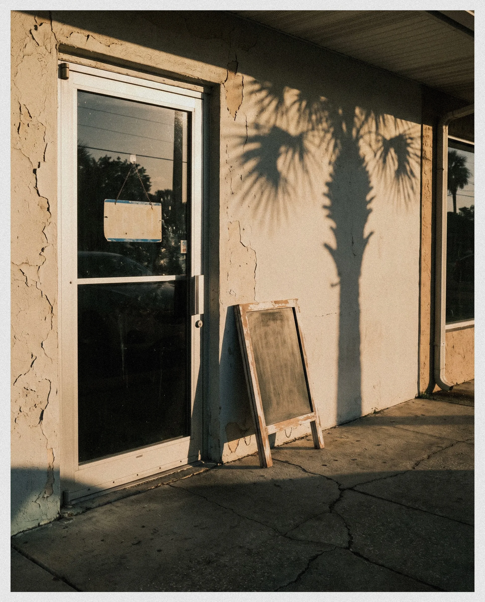 The front door of an independent Florida restaurant at golden hour.